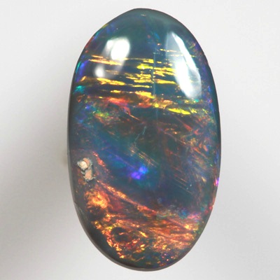 SOLID BLACK OPAL Bright neon golds, yellow and red over blue